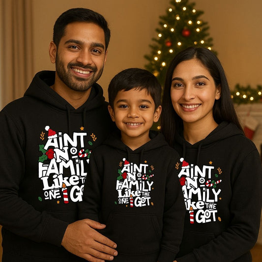 Family of three wearing matching Black Hoodies