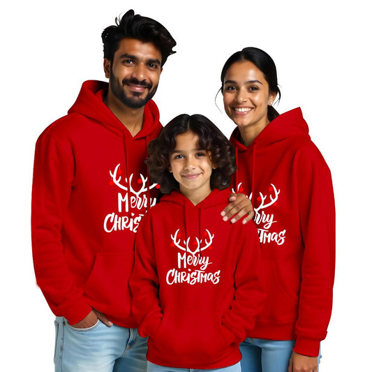 Red Family of three wearing white hoodies with 'Merry Christmas' text