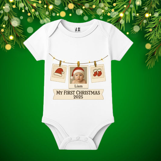 White baby onesie with 'My First Christmas 2025' text and baby photos