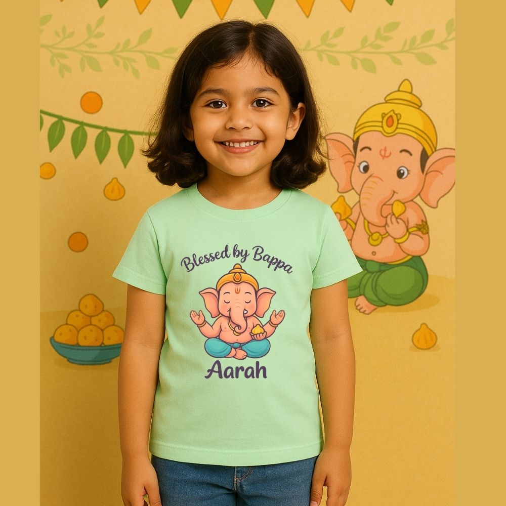 Festive Ganesh Chaturthi T-Shirt Mintgreen t-shirt with a cartoon character and text