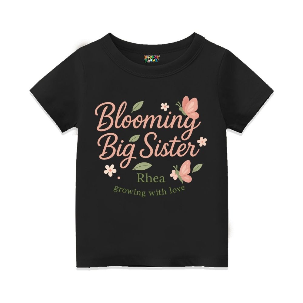 'Blooming Big Sister' and Growing with Love text, with floral and butterfly design printed, Black t-shirt.