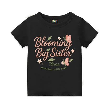 'Blooming Big Sister' and Growing with Love text, with floral and butterfly design printed, Black t-shirt.