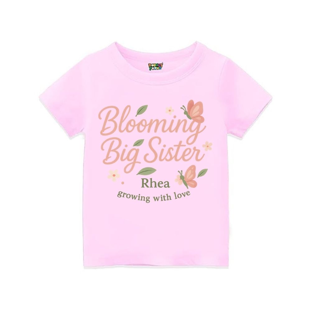 'Blooming Big Sister' and Growing with Love text, with floral and butterfly design printed, Ltpink t-shirt.