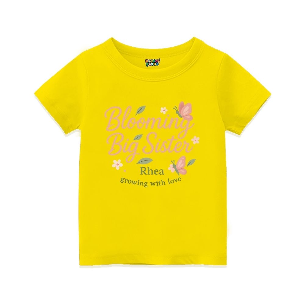 'Blooming Big Sister' and Growing with Love text, with floral and butterfly design printed, Yellow t-shirt.
