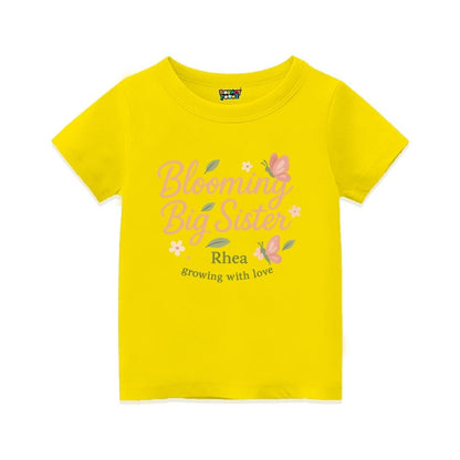 'Blooming Big Sister' and Growing with Love text, with floral and butterfly design printed, Yellow t-shirt.
