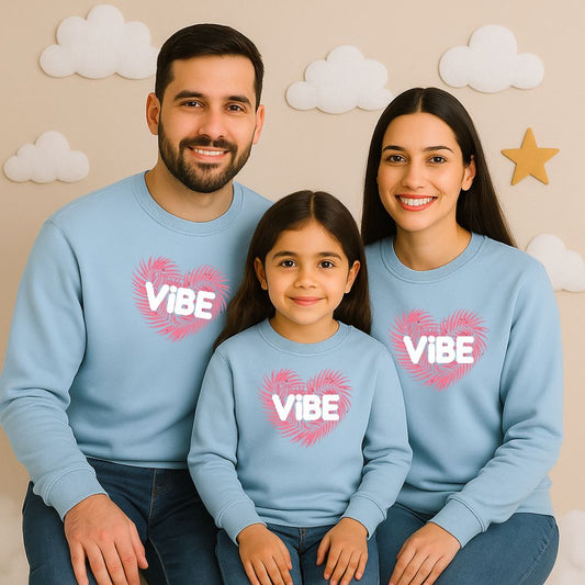 Family matching pastelblue sweatshirts with 'VIBE' design