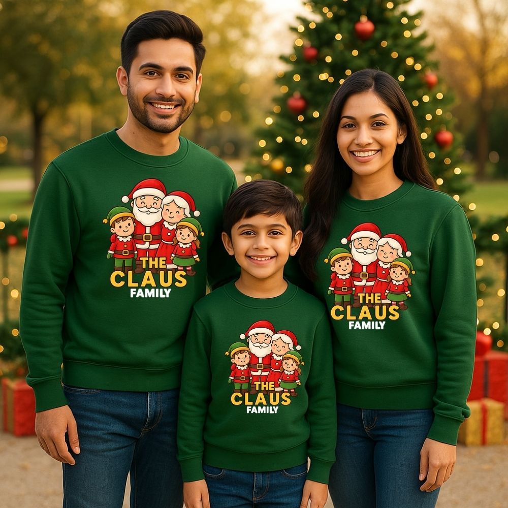 Family of three wearing matching Christmas-themed sweatshirts with 'The Claus Family' design Bottlegreen