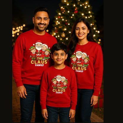 Family of three wearing matching Christmas-themed sweatshirts with 'The Claus Family' design Red