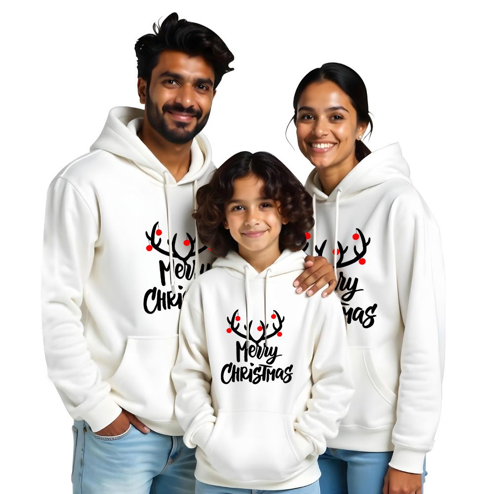 Family of three wearing white hoodies with 'Merry Christmas' text 