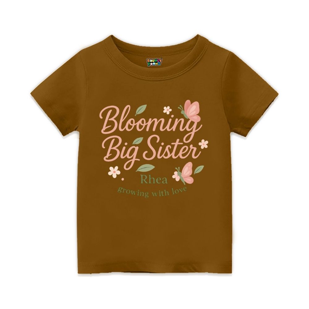 'Blooming Big Sister' and Growing with Love text, with floral and butterfly design printed, Peanutbrown t-shirt.