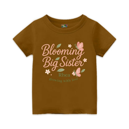 'Blooming Big Sister' and Growing with Love text, with floral and butterfly design printed, Peanutbrown t-shirt.