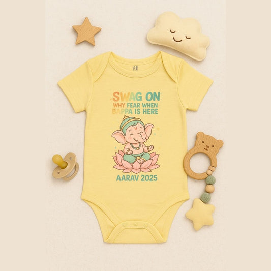Lt Yellow baby onesie with name and year Ganesh chathurthi Tshirt