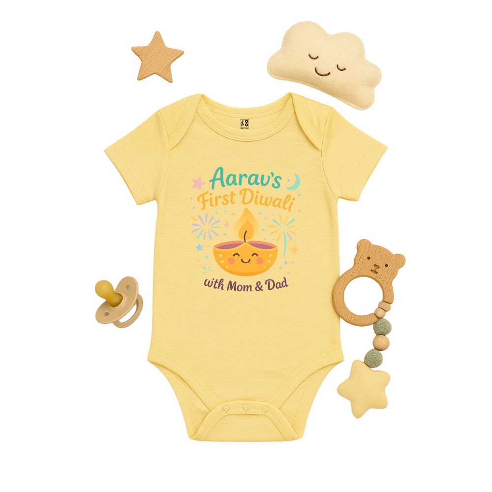 Ltyellow baby onesie with 'First Diwali with Mom & Dad' text and a smiling lamp design 