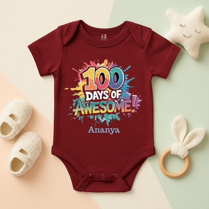 Maroon baby onesie with '100 Days of Awesome' textwith Coloursplash design