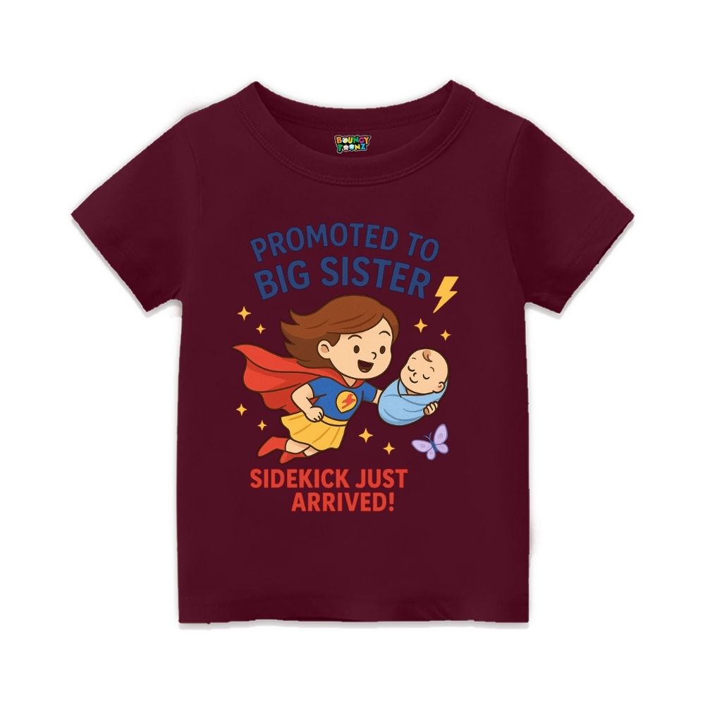 Maroon t-shirt with superhero design and text 'Promoted to Big Sister, Sidekick Just Arrived!' 