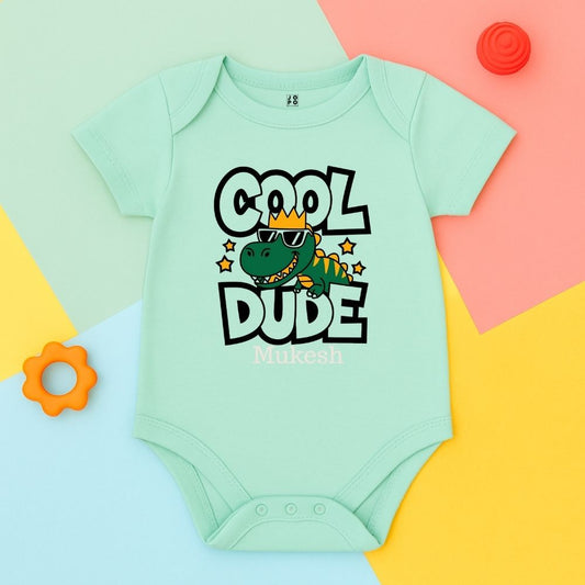 Mint green baby onesie with 'Cool Dude' text 