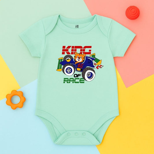 Mint green baby onesie with a racing car design with 'King Of Race' text