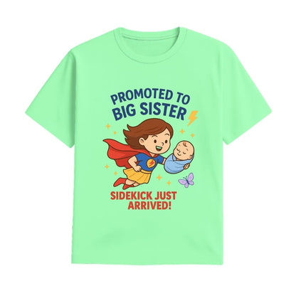 Mintgreen t-shirt with superhero design and text 'Promoted to Big Sister, Sidekick Just Arrived!' 