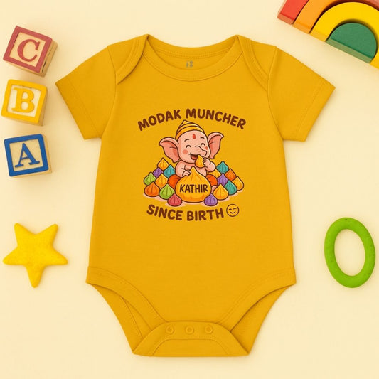 Mustard baby onesie with a cartoon character for Vinayagar Chathurthi Celebration