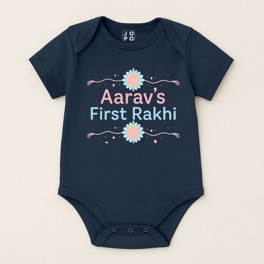 Navyblue baby onesie with 'Aarav's First Rakhi' text with Rakhi Design