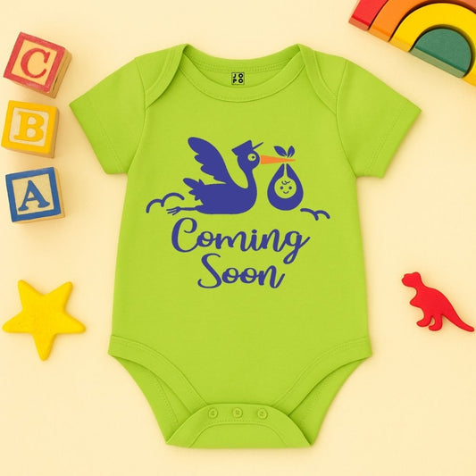 NeonGreen baby onesie with stork and 'Coming Soon' text 