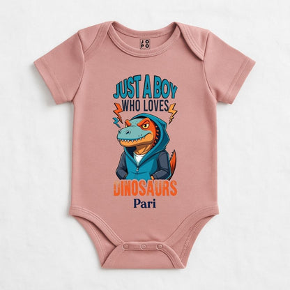 Pastel Pink baby onesie with a dinosaur graphic and text 