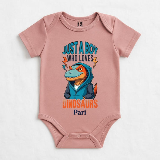 Pastel Pink baby onesie with a dinosaur graphic and text 
