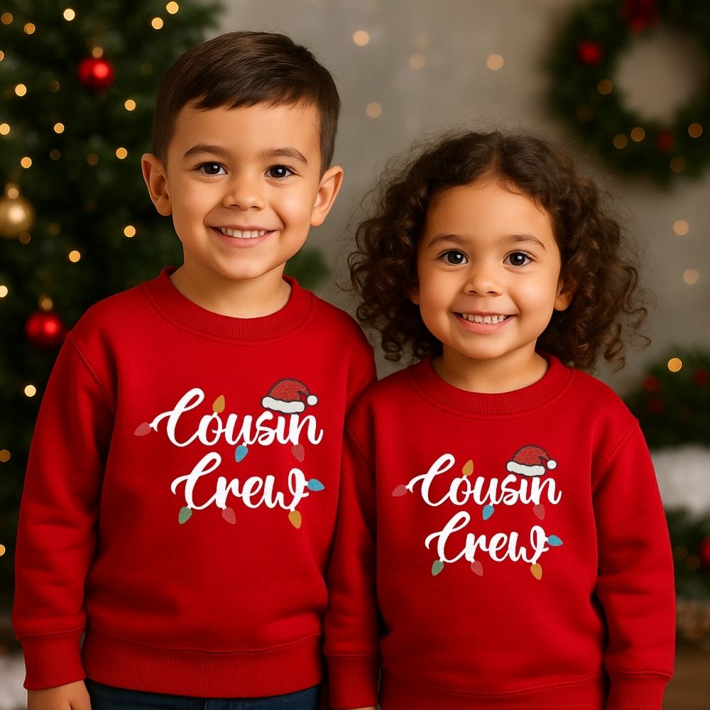 Red Two children wearing 'Cousin Crew' sweatshirts