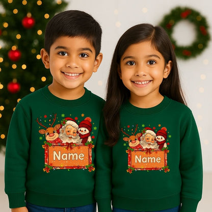 Two children wearing Bottlegreen Christmas-themed sweatshirts