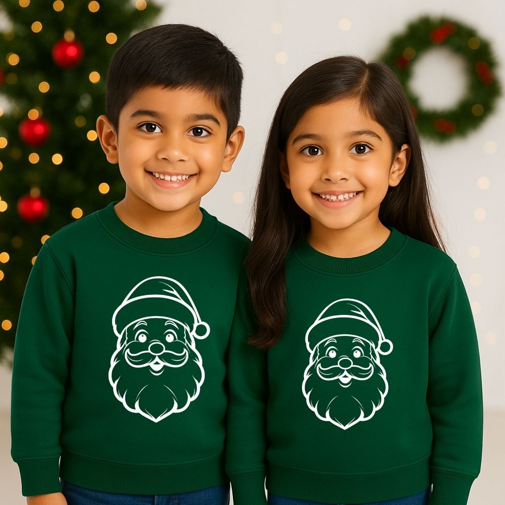 Two children wearing Bottlegreen sweatshirts with Santa Claus faces