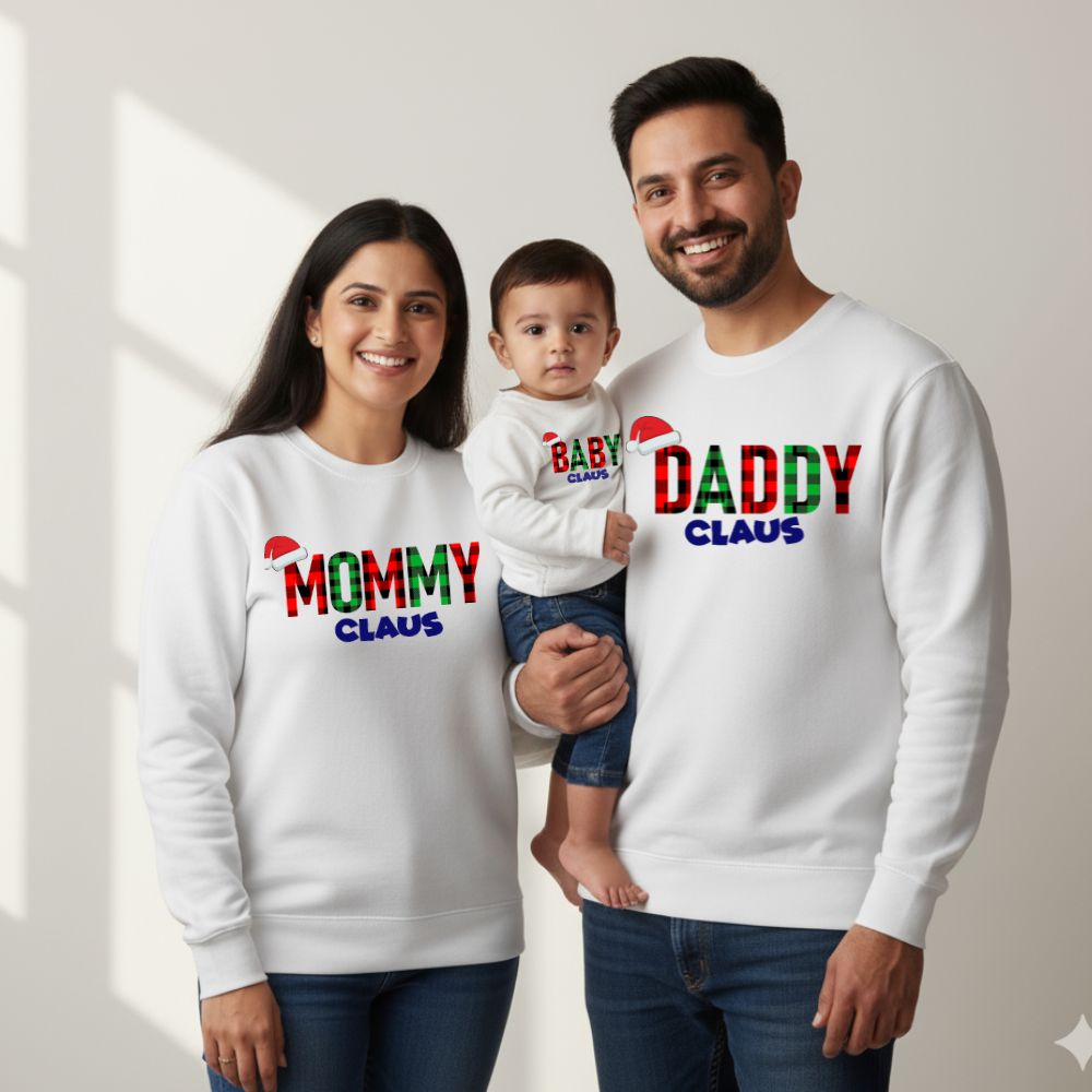 White Family of three wearing matching 'Mommy Claus', 'Baby Claus', and 'Daddy Claus' sweatshirts.