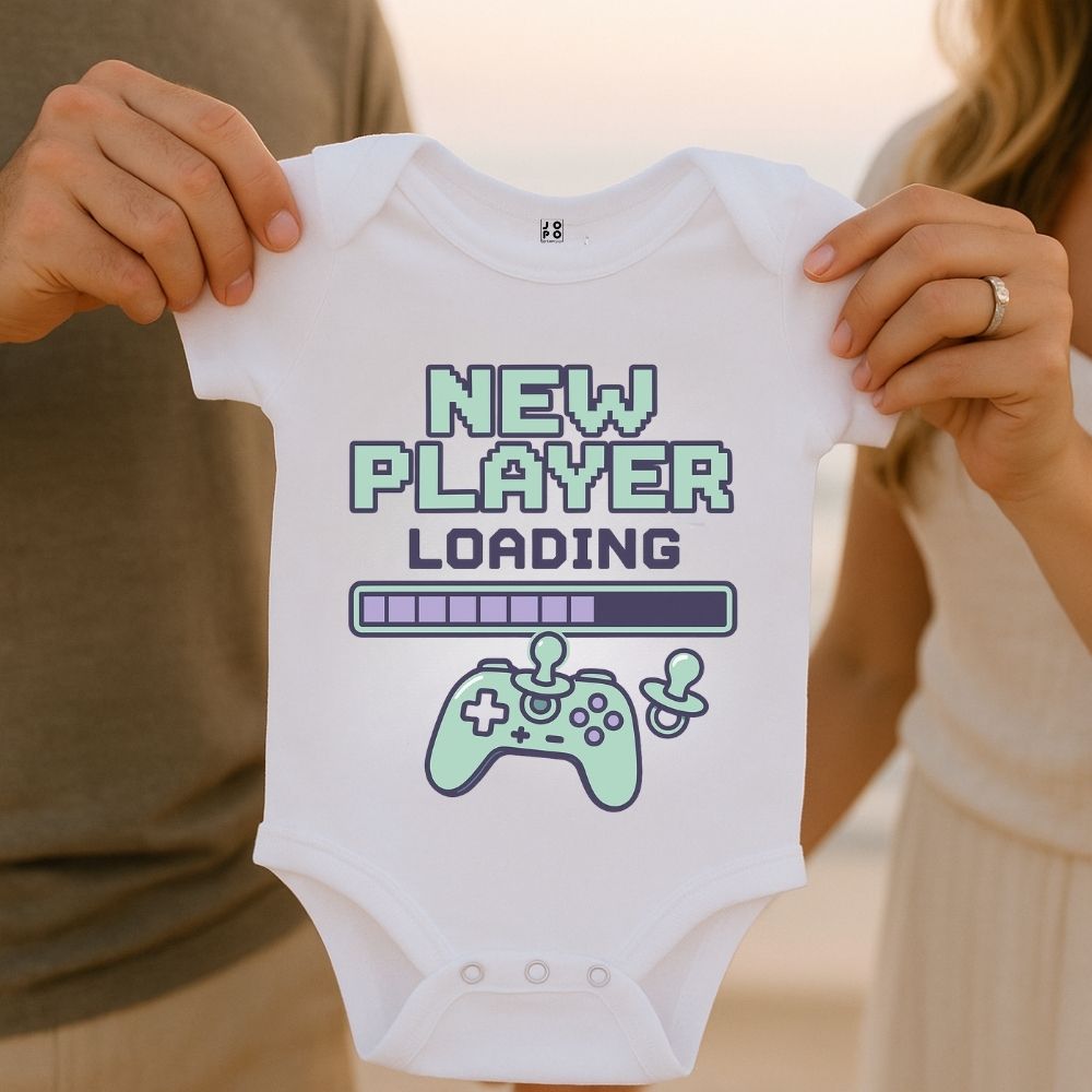 White baby onesie with 'New Player Loading' text and Game controller and Loading Bar graphics design