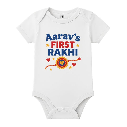 White baby onesie with colorful text and graphics 