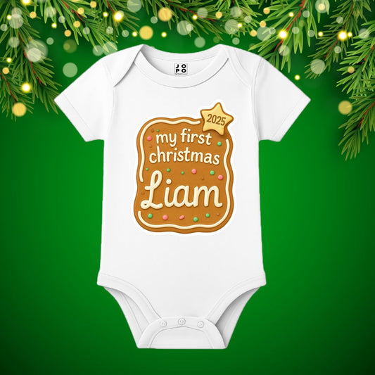 White baby onesie with 'my first Christmas 2025' design