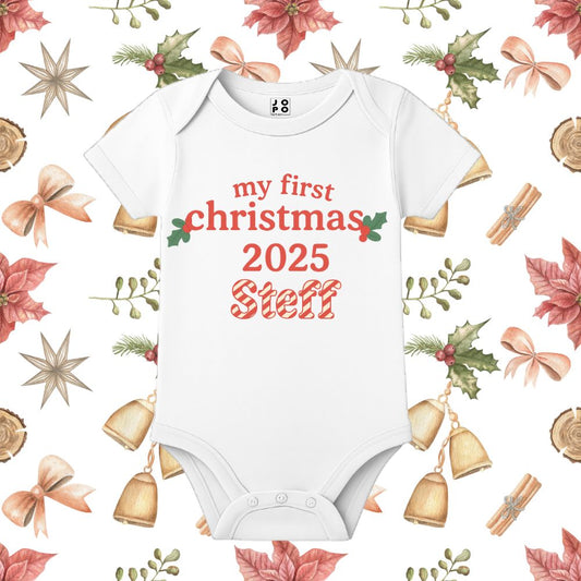 White baby onesie with 'my first christmas 2025 ' text with chritmas motifs
