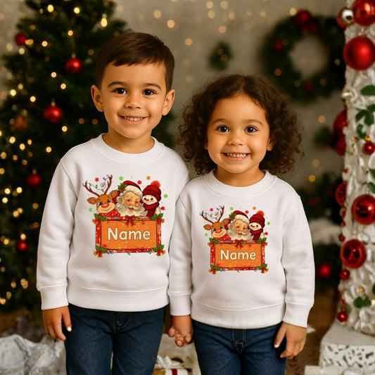 wo children wearing White Christmas-themed sweatshirts